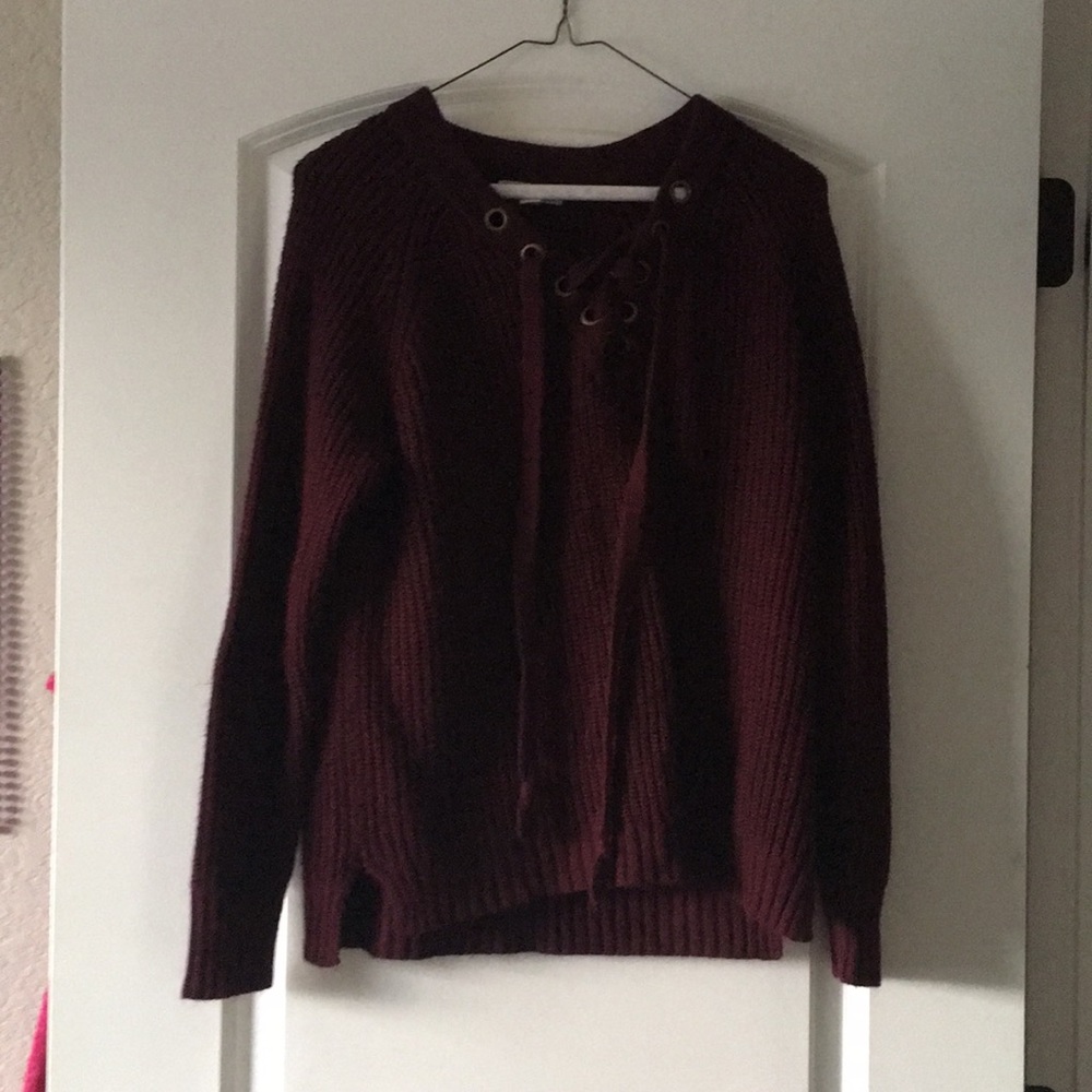 Red, black, and green sweaters